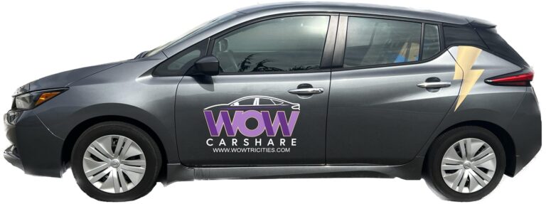 A black Nissan Leaf with WOW EV Car Share branding